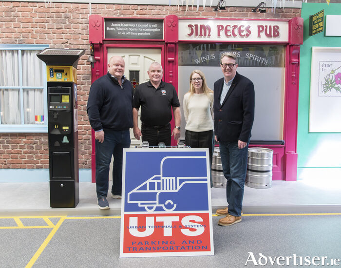 Photo of UTS Technologies management team with Claddagh Watch announcing sponsorship